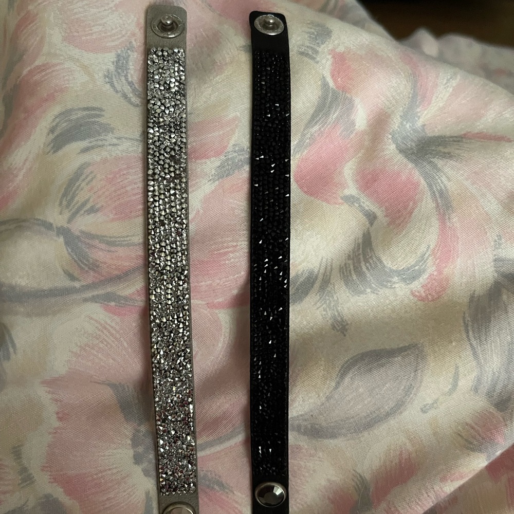 Sparkling wrist bands in silver and black. 12.00 for both.